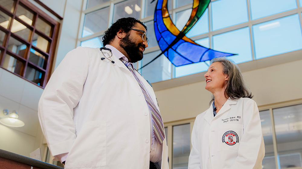 Friendly Amarillo physicians visit with each other in the lobby