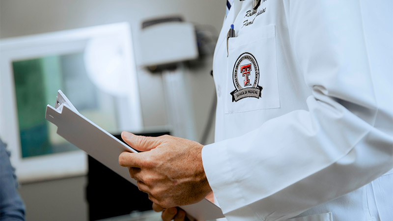 Provider holding clipboard