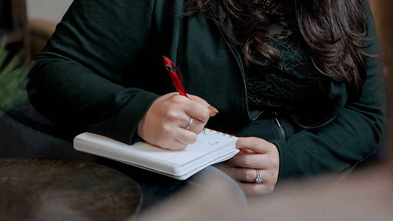 Provider writing in a journal