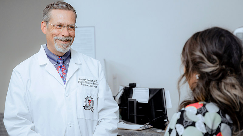 Provider smiling at staff member 